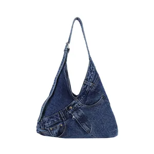 Deep blue washed denim hobo bag with creative jeans pocket design and metal rivets