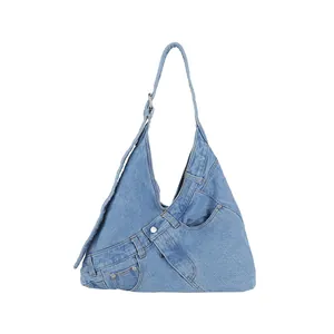 Chic blue denim shoulder bag featuring creative jeans-style waist and pocket design