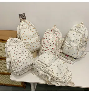 Detailed collection of five off-white backpacks with strawberry, cherry and fruit prints