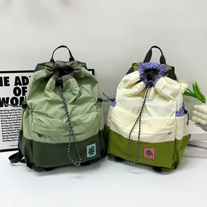 Lightweight nylon drawstring backpack with color blocking and embroidered plant patch