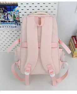 Vista posteriore dello zaino ergonomico rosa con spallacci a S e tasche laterali