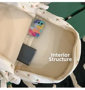 Internal structure of floral backpack showing spacious main compartment and phone pocket
