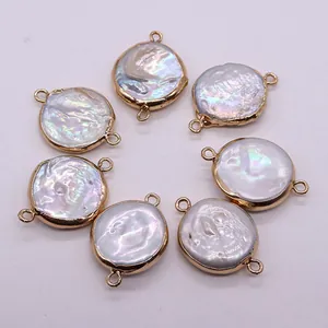 Macro detail of natural freshwater baroque pearl connectors with golden metal frames