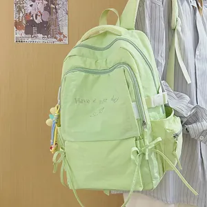 Zaino scolastico verde menta con ricamo Have a Nice Day e tasche multiple funzionali