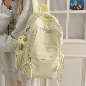 Zaino scolastico in nylon giallo chiaro con ricamo 'Have a nice day' e fiocco