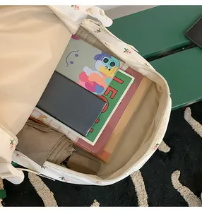 Interior view showing the large capacity and multiple compartments of the floral backpack