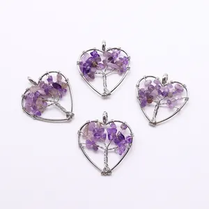 Detailed view of four heart-shaped tree of life pendants with purple amethyst stones