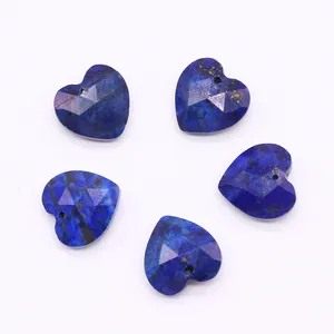 Detailed view of five heart-shaped blue natural stone beads with faceted surface