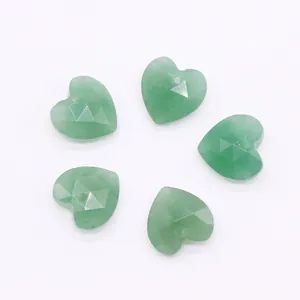 Macro shot of 5 faceted heart-shaped green natural stone pendants with top-drilled holes
