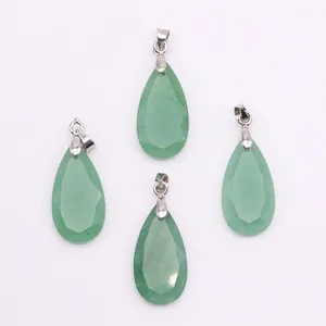 Detailed view of four faceted green natural stone teardrop pendants with silver bails