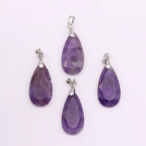 Close-up of four purple teardrop faceted amethyst crystal pendants with silver bails