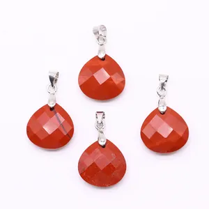 Detailed view of faceted teardrop red jasper pendants with silver bail connectors