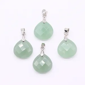 Macro detail of faceted pear-shaped light green natural stone pendants with silver clasps