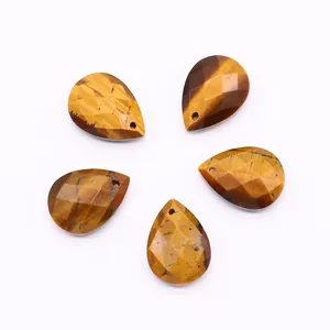 Macro view of five teardrop faceted tiger eye stones for jewelry making and DIY projects