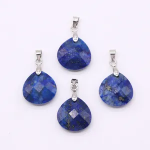 Detailed view of four teardrop-shaped lapis lazuli pendants with faceted blue stone texture