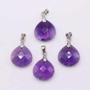 Detailed view of four faceted purple amethyst teardrop pendants with silver bails