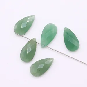 Macro shot of five faceted green aventurine teardrop gemstones for DIY jewelry making