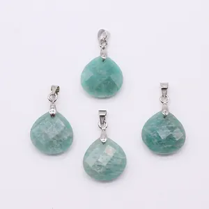 Detail of four faceted teardrop natural stone pendants with silver metal bails