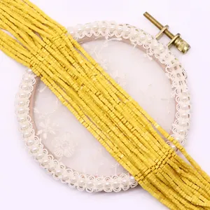 Detailed view of square yellow natural stone beads for DIY jewelry and necklaces