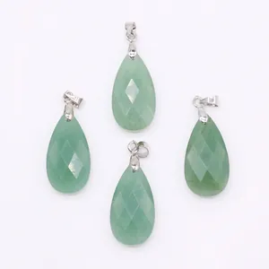 Macro detail of faceted green teardrop natural stone pendants with silver metal clasps
