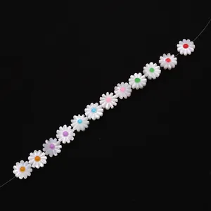 Detailed macro view of colorful daisy shell beads for DIY jewelry making and necklace crafts