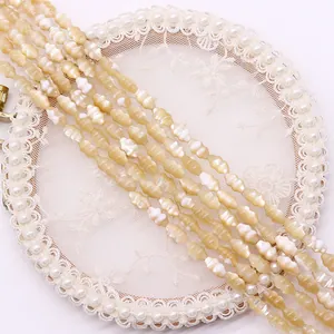 Macro shot of natural shell spindle beads with pearlescent luster for DIY jewelry