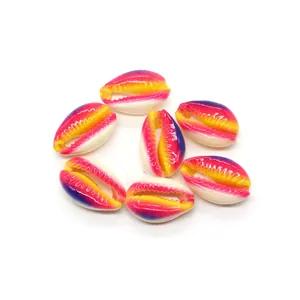 Macro detail of colorful cowrie shell beads with rainbow oil-drop finish for DIY jewelry