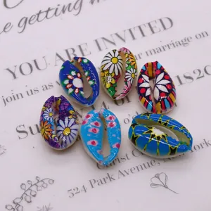 Set of six natural painted cowrie shell beads with bohemian floral patterns for DIY jewelry