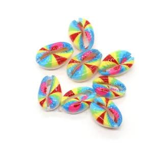 Close-up of rainbow painted natural cowrie shells for DIY jewelry making accessories