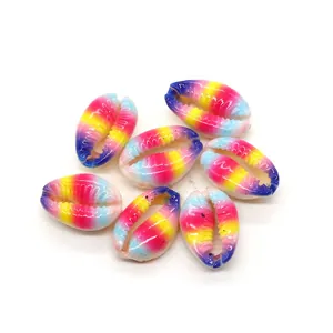 Macro shot of colorful rainbow spray painted natural shells for DIY jewelry making