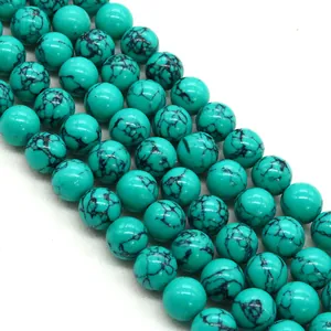 Perline rotonde blu turchese con trama a rete nera per la creazione di collane fai-da-te