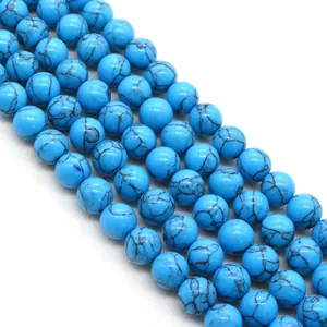 Perline rotonde in turchese blu brillante con venature nere per creazione gioielli