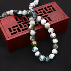 Natural moss agate round beads for DIY jewelry making on vintage decorative wooden box