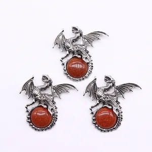 Detailed trio of vintage silver Viking dragon pendants inlaid with brown goldstone gems