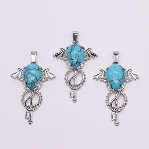 Gothic bat wing key pendant featuring teardrop turquoise and silver metal finish