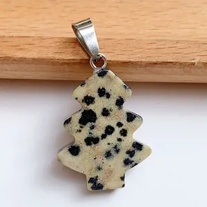 Detail of dalmatian jasper Christmas tree pendant with silver metal bail attachment