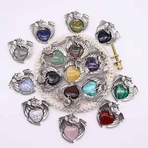 Silver dragon wrapped heart pendant set with various natural gemstones and crystals