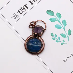 Vintage copper pendant featuring purple amethyst and blue lace agate in a natural stone design