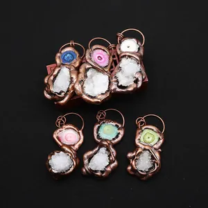 Set of six irregular natural stone pendants with antique bronze electroplated edging