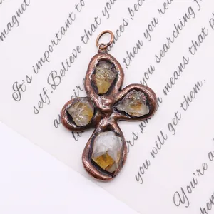 Macro detail of natural crystal stone pendant with vintage bronze petal-shaped metal frame