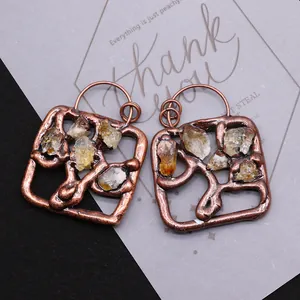 Square bronze pendant with natural yellow crystal stone in a rustic bohemian style