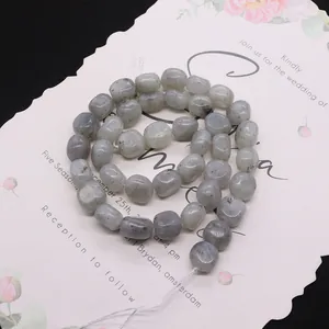 Polished natural labradorite pebble beads on floral card for DIY jewelry making
