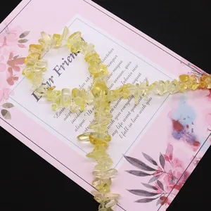 Natural citrine irregular chip beads for jewelry making on pink decorative card
