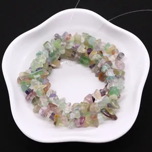 Irregular natural fluorite gravel beads for DIY jewelry making in a white ceramic dish