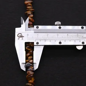 Macro shot of natural irregular tiger eye stone beads measured at 8-10mm with a caliper