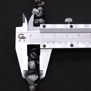 Detailed view of irregular snowflake obsidian stone beads measuring approximately 9mm for DIY