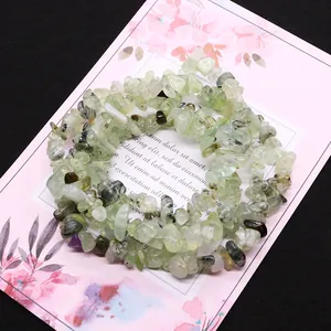 Natural irregular prehnite stone beads on a floral decorative card for DIY jewelry