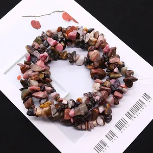 Irregular natural rhodonite stone beads for DIY jewelry making on a white card