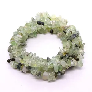 Polished irregular green prehnite chips stretch bracelet with black gemstone accents