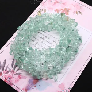 Natural irregular green crystal chips for DIY jewelry making on decorative floral card